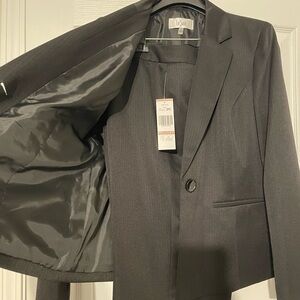 Brand New Two piece pantsuit, with tags.